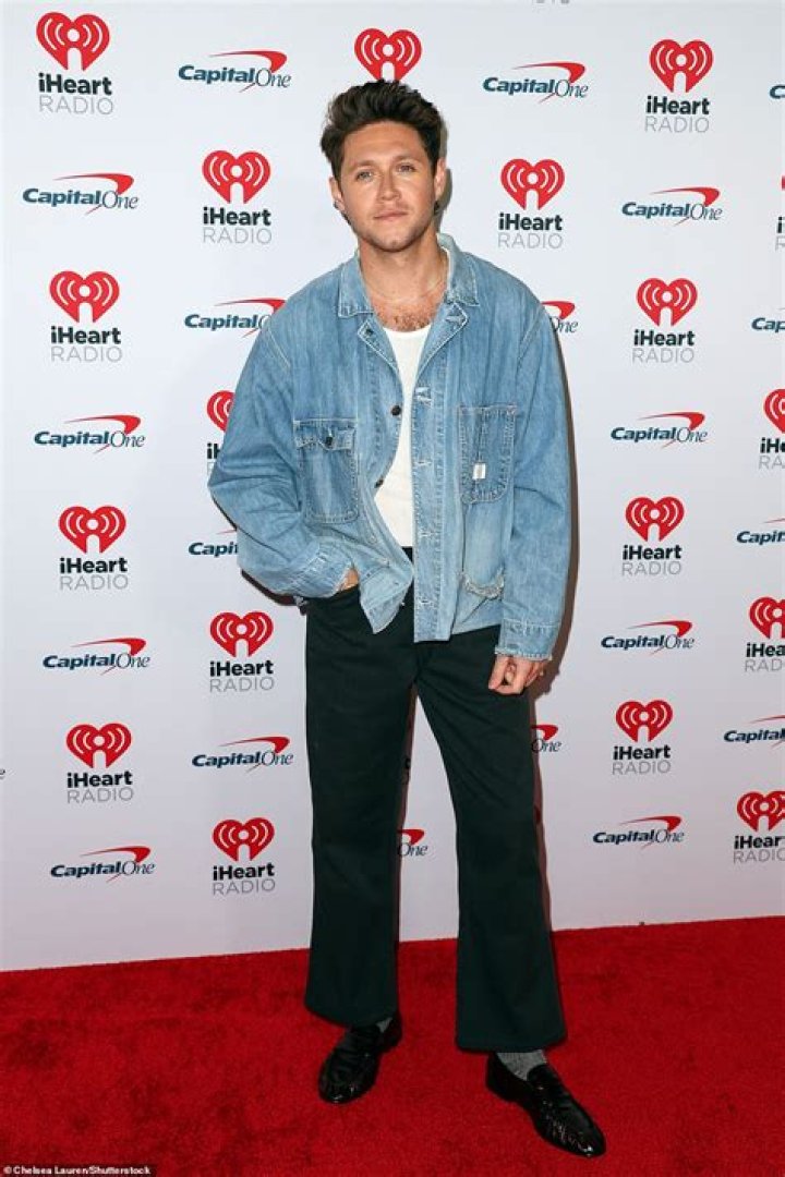 Neil finalized his look with black loafers